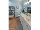 Elegant bathroom with marble vanity and decorative shelving at 10030 W Indian School Rd # 101, Phoenix, AZ 85037