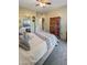 Bright bedroom with a comfortable bed and ample closet space at 10030 W Indian School Rd # 101, Phoenix, AZ 85037