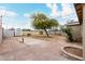 Backyard with large tree and brick patio at 1022 E Mariposa St, Phoenix, AZ 85014