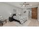 Bright bedroom with wood-look floors and barn door at 1022 E Mariposa St, Phoenix, AZ 85014