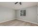 Bright bedroom with wood-look floors and ceiling fan at 1022 E Mariposa St, Phoenix, AZ 85014