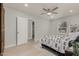 Well-lit bedroom featuring a ceiling fan and light flooring at 1022 E Mariposa St, Phoenix, AZ 85014