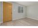 Entryway with wood-look floors and mustard-colored door at 1022 E Mariposa St, Phoenix, AZ 85014