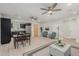 Open living room, dining area, and kitchen with light wood floors at 1022 E Mariposa St, Phoenix, AZ 85014