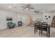 Open living room and dining area with light wood floors and ceiling fans at 1022 E Mariposa St, Phoenix, AZ 85014