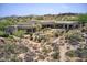 Expansive aerial view of the property featuring lush desert landscaping and serene desert living at 10567 E Mark Ln, Scottsdale, AZ 85262