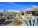 An inviting backyard pool and desert landscape create a perfect oasis for relaxation and entertainment at 10567 E Mark Ln, Scottsdale, AZ 85262