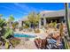 Beautiful backyard showcasing desert plants, a pool, and serene desert living at 10567 E Mark Ln, Scottsdale, AZ 85262