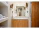 Stylish bathroom featuring a vessel sink, wooden accents, and built in storage at 10567 E Mark Ln, Scottsdale, AZ 85262