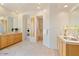 Bright bathroom featuring dual vanities, flagstone flooring, and decorative accents at 10567 E Mark Ln, Scottsdale, AZ 85262