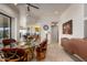 Comfortable dining area showcasing the beautiful stone flooring, open floor plan, and bright, neutral paint colors at 10567 E Mark Ln, Scottsdale, AZ 85262