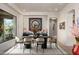 Elegant dining room with modern furniture, neutral paint colors, stone floors, and an inviting atmosphere at 10567 E Mark Ln, Scottsdale, AZ 85262