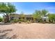 Stunning desert home with a paver driveway and desert landscaping at 10567 E Mark Ln, Scottsdale, AZ 85262