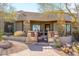 Inviting home entrance with a stone accented gate and walkway leading to the front door, enhancing curb appeal at 10567 E Mark Ln, Scottsdale, AZ 85262