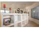 Hallway with built-in shelves, decorative pieces, and natural light at 10567 E Mark Ln, Scottsdale, AZ 85262