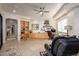 Home office featuring a large desk, built-in shelving, and stone floors at 10567 E Mark Ln, Scottsdale, AZ 85262