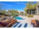 Inviting backyard pool and patio with comfortable lounge chairs, perfect for relaxing at 10567 E Mark Ln, Scottsdale, AZ 85262