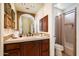 Clean bathroom with a single vanity and tub shower combo at 10638 E Blanche Dr, Scottsdale, AZ 85255