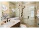 Modern bathroom with glass shower and wood vanity at 10638 E Blanche Dr, Scottsdale, AZ 85255