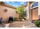 Inviting front courtyard with seating area and desert landscaping at 10638 E Blanche Dr, Scottsdale, AZ 85255