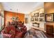 Comfortable living room featuring hardwood floors and art accents at 10638 E Blanche Dr, Scottsdale, AZ 85255