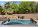 Inviting kidney-shaped pool with stone waterfall feature at 10638 E Blanche Dr, Scottsdale, AZ 85255