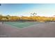 Two lighted tennis courts with mountain backdrop at 10638 E Blanche Dr, Scottsdale, AZ 85255