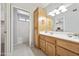 Bathroom with light wood vanity and a shower/tub combo at 10826 N 115Th Ave, Youngtown, AZ 85363