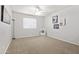 Bright bedroom with ceiling fan and neutral carpeting at 10826 N 115Th Ave, Youngtown, AZ 85363