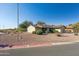 Front view of a house with landscaping and a driveway at 10826 N 115Th Ave, Youngtown, AZ 85363