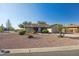 Single-story home with desert landscaping and a two-car garage at 10826 N 115Th Ave, Youngtown, AZ 85363