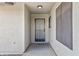 Front door entry with security screen door and neutral colored walls at 10826 N 115Th Ave, Youngtown, AZ 85363