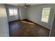 Bedroom with two windows and wood flooring at 11658 N 153Rd Ave, Surprise, AZ 85379