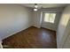 Bright bedroom with wood-look floors and ceiling fan at 11658 N 153Rd Ave, Surprise, AZ 85379