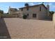 Spacious backyard with gravel and a view of the house at 1305 W Isabella Ave, Mesa, AZ 85202