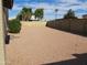 Large gravel backyard with a partial view of the house at 1305 W Isabella Ave, Mesa, AZ 85202