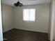 Bright bedroom with wood-look floors and window blinds at 1305 W Isabella Ave, Mesa, AZ 85202