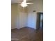 Spacious bedroom with ceiling fan and large closet at 1305 W Isabella Ave, Mesa, AZ 85202