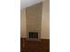 Brick fireplace in living room with dark hearth at 1305 W Isabella Ave, Mesa, AZ 85202