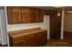 View of kitchen's wood cabinets and countertops at 1305 W Isabella Ave, Mesa, AZ 85202