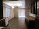 Kitchen with dark wood cabinets, tile floors, and access to backyard at 1305 W Isabella Ave, Mesa, AZ 85202