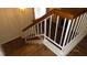 Wooden staircase with white railings overlooking living room at 1305 W Isabella Ave, Mesa, AZ 85202