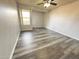 Spacious bedroom with ceiling fan and wood-like vinyl flooring at 1331 W Baseline Rd # 244, Mesa, AZ 85202