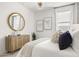 Modern bedroom with a large mirror and stylish decor at 15374 W Hackamore Dr, Surprise, AZ 85387