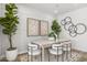 Bright dining area with modern light wood table and seating for six at 15382 W Hackamore Dr, Surprise, AZ 85387