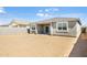 Sandy backyard with patio and block wall at 15429 W Hackamore Dr, Surprise, AZ 85387