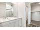 Double vanity bathroom with marble shower and walk-in closet at 15429 W Hackamore Dr, Surprise, AZ 85387