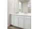 Double sink bathroom vanity with white cabinets at 15429 W Hackamore Dr, Surprise, AZ 85387