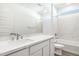 Bathroom with single vanity, tub, and marble at 15429 W Hackamore Dr, Surprise, AZ 85387