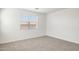 Simple bedroom with carpet, window, and blinds at 15429 W Hackamore Dr, Surprise, AZ 85387